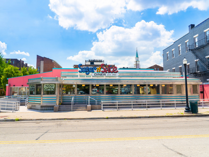 A small diner with aluminum railing